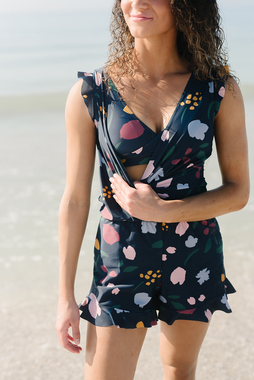 the bestselling Ginger Swim Romper in our NEW print: sunrise bouquet! we'll  take any chance we can get to show off that built in sports